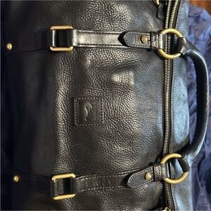 Dooney & Bourke Black Leather Satchel with Gold Accents